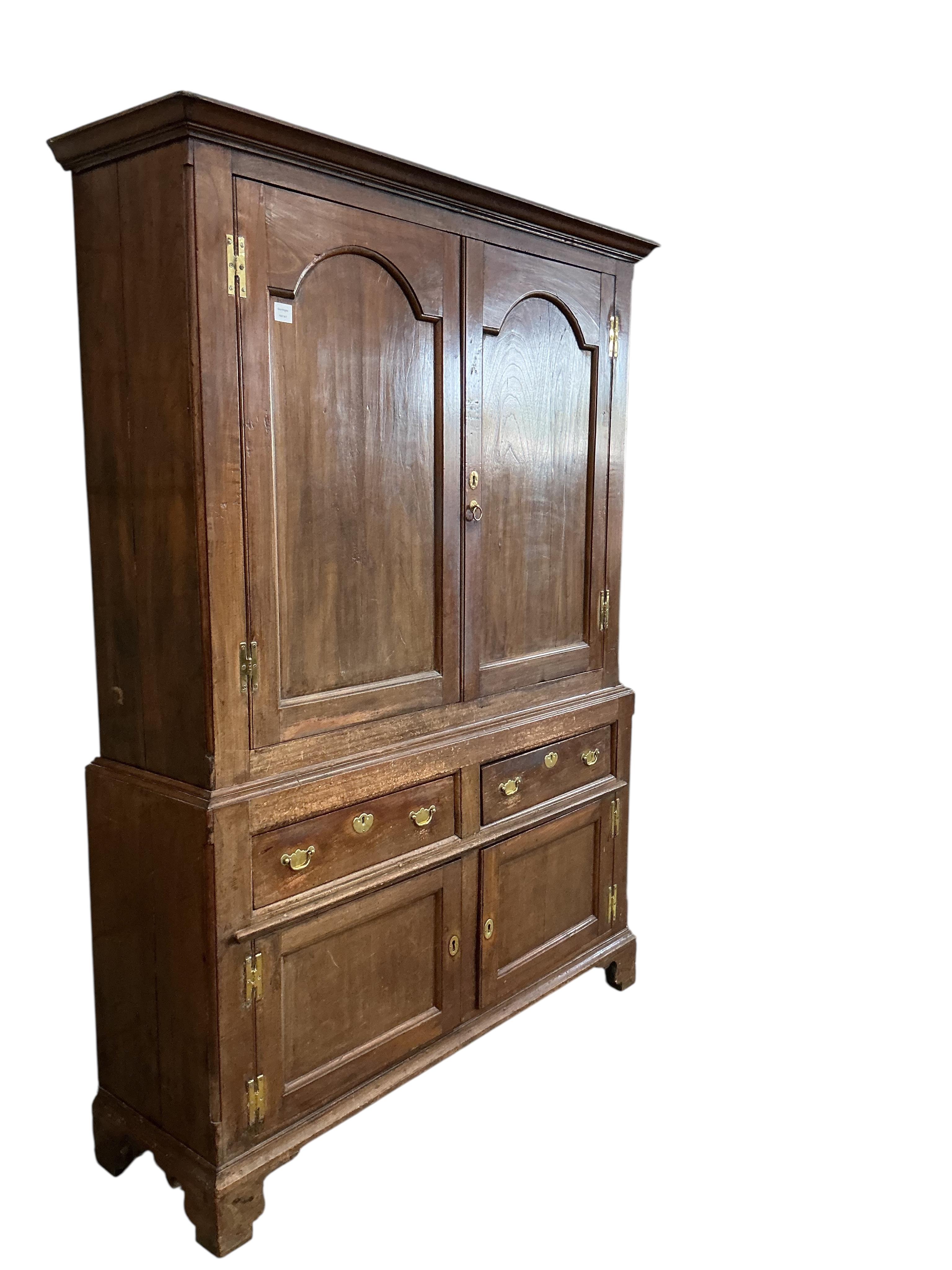 A George III fruitwood press cupboard, width 144cm, depth 41cm, height 204cm